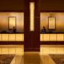 Registration desk and column accents in ViviStone Honey Onyx glass shown in back